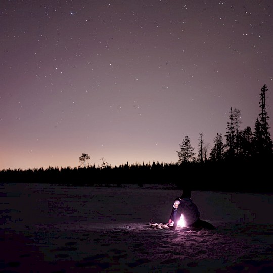 Campfire under a starry sky